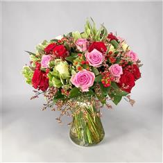 Red pink and white rose vase arrangement